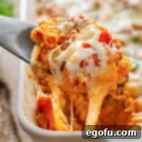 Close up looking at a serving utensil getting a scoop of Pizza Hut Cavatini.