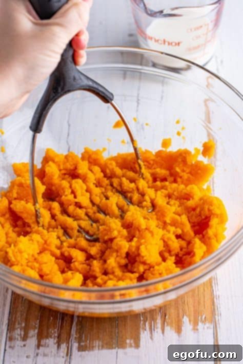 Mashed sweet potatoes in a bowl, ready for the next step.