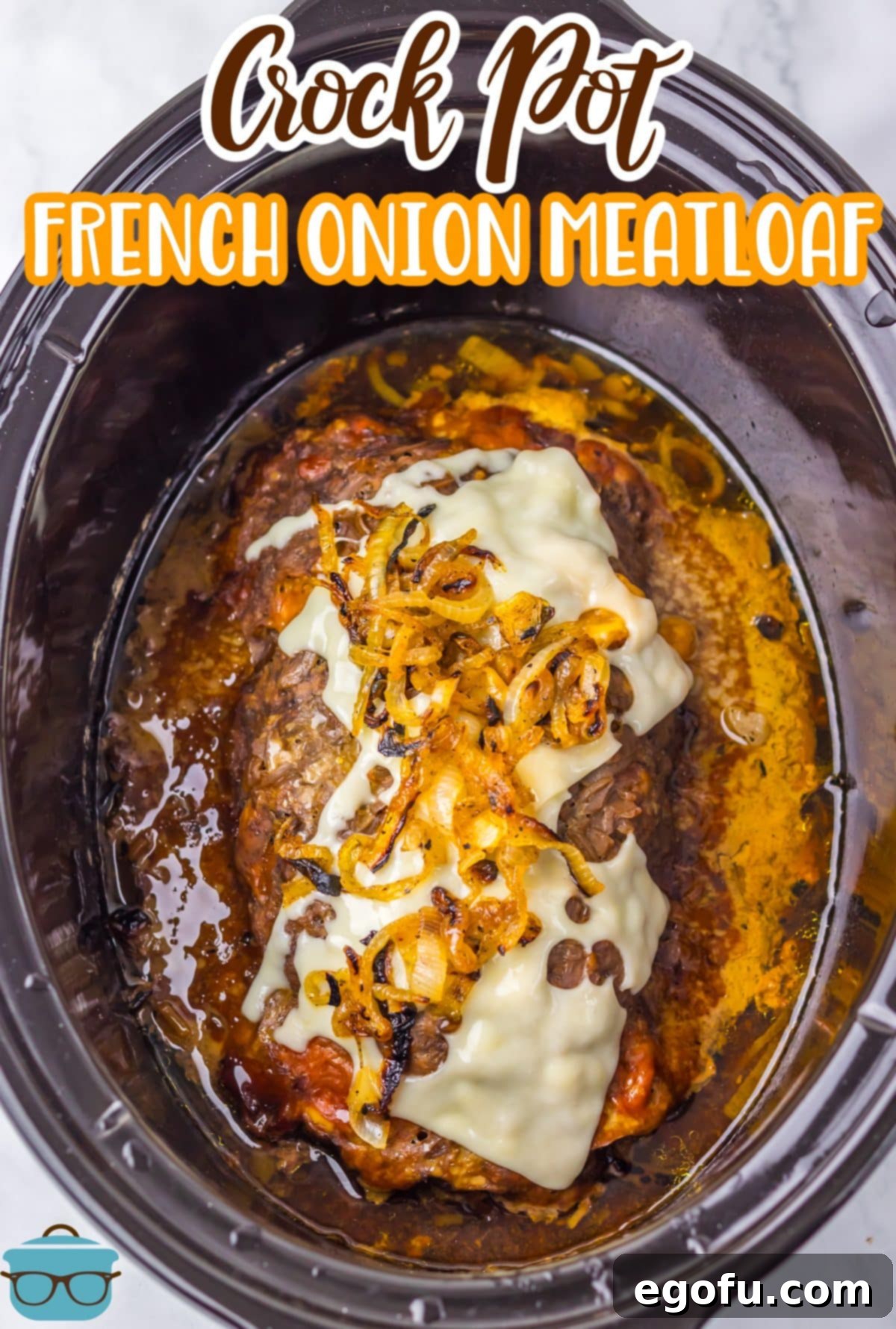 A close-up view of Crock Pot French Onion Meatloaf, showing the tender texture and melted Swiss cheese.