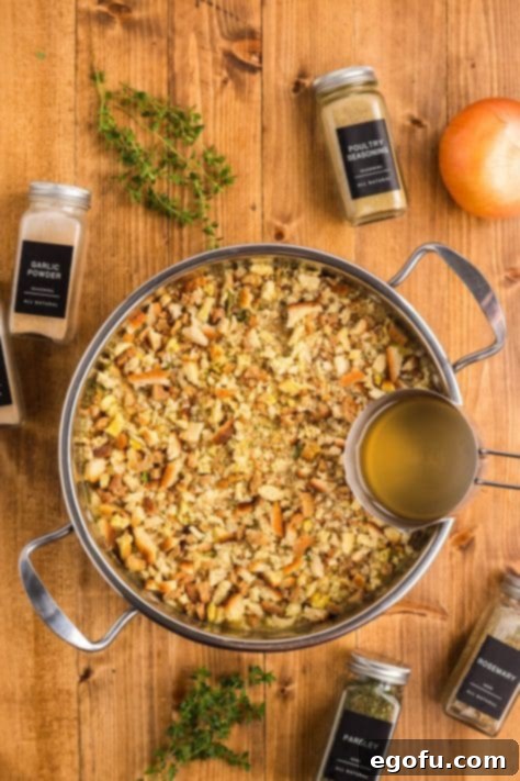 Chicken broth being added to a Chicken and Stuffing dish.