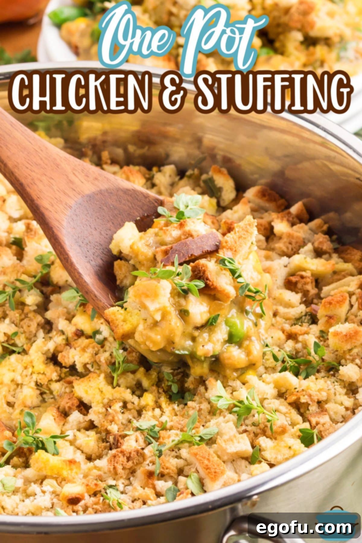 A pot of creamy Chicken and Stuffing being stirred with a wooden utensil.