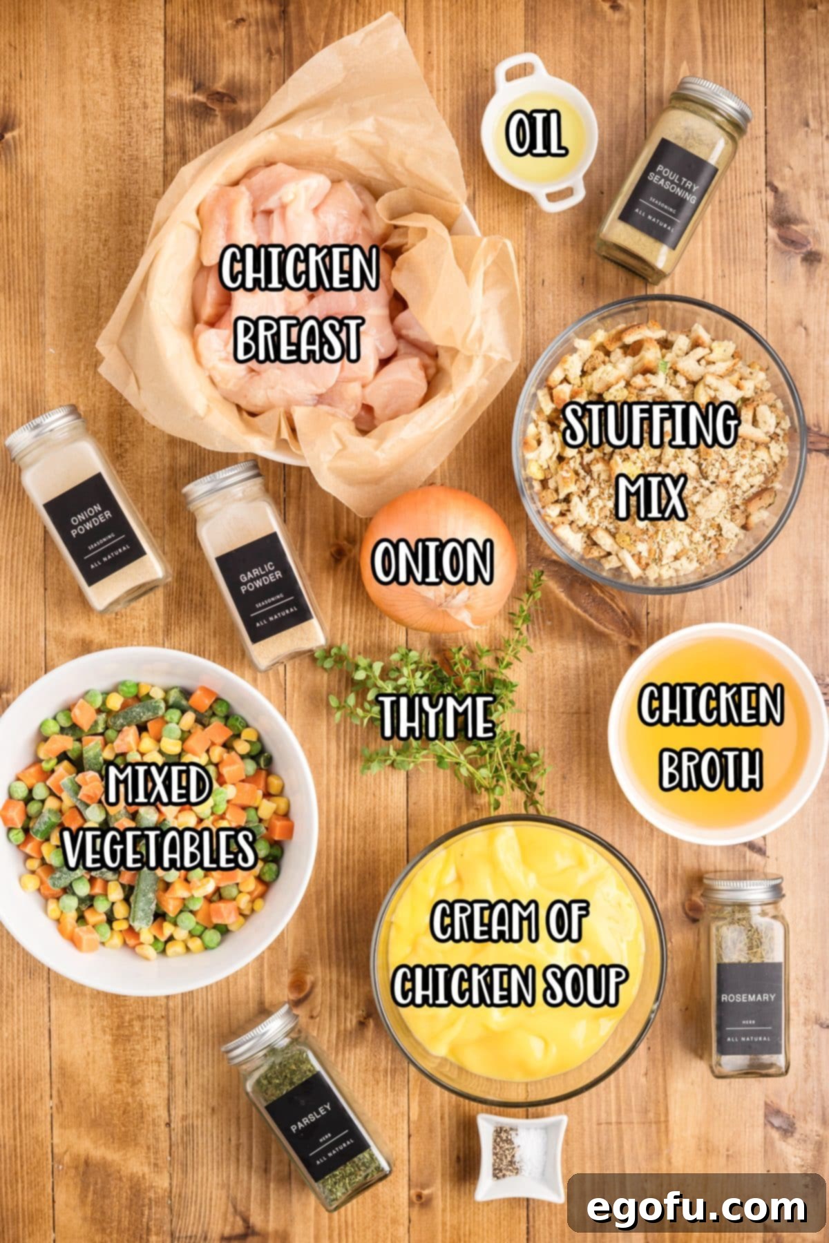 Ingredients laid out: chicken breasts, yellow onion, oil, salt, pepper, frozen mixed vegetables, low sodium chicken broth, low sodium cream of chicken soup, parsley, rosemary, poultry seasoning, garlic powder, onion powder, stuffing mix, and fresh thyme.