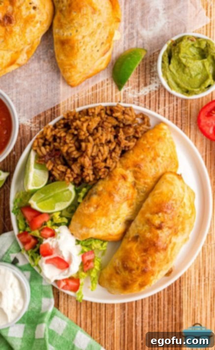 Looking down on a few Taco Pockets with rice and various toppings.