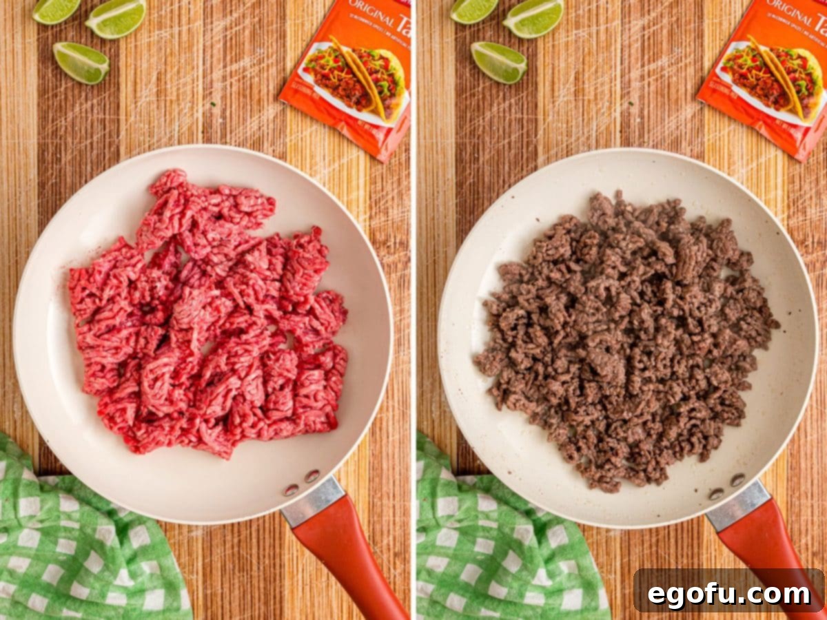 Ground beef cooking in a skillet, crumbling and browning.