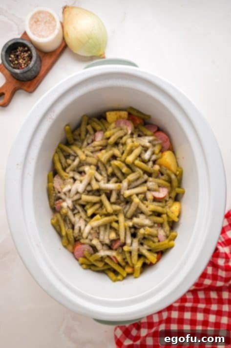 Bayou Slow Cooker Potatoes 11 Seasonings over uncooked Swamp Potatoes in a Slow Cooker.