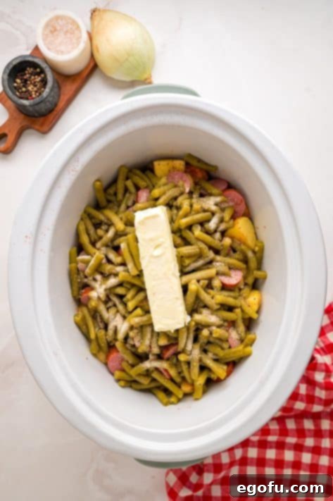 Bayou Slow Cooker Potatoes 12 Butter on top of a full Slow Cooker.