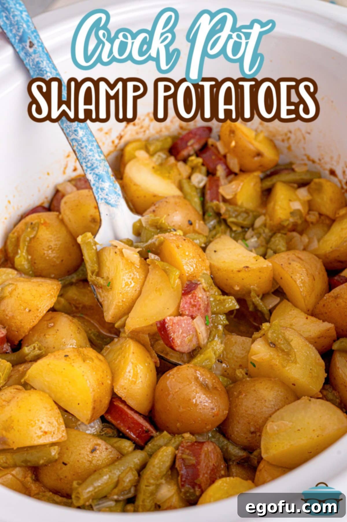 Bayou Slow Cooker Potatoes 4 A spoon getting a scoop of Slow Cooker Swamp Potatoes.