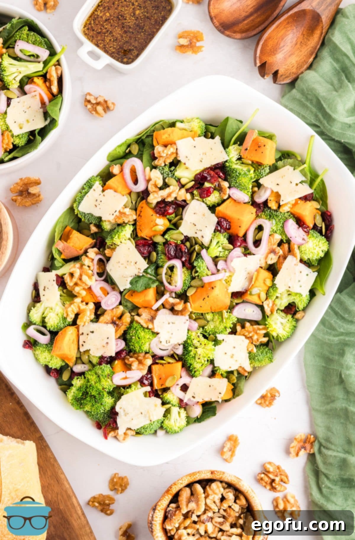 Looking down on a big salad serving bowl with Autumn Salad, showcasing its vibrant colors and fresh ingredients ready to be enjoyed.