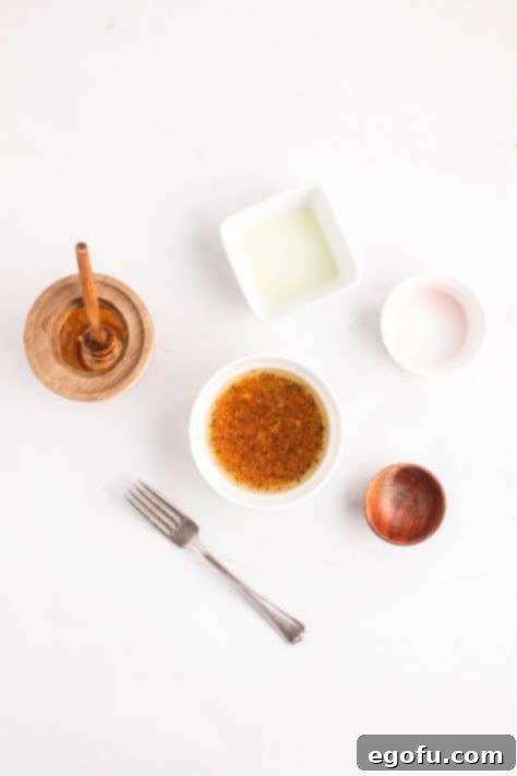 Mixing vinaigrette ingredients in a small bowl.