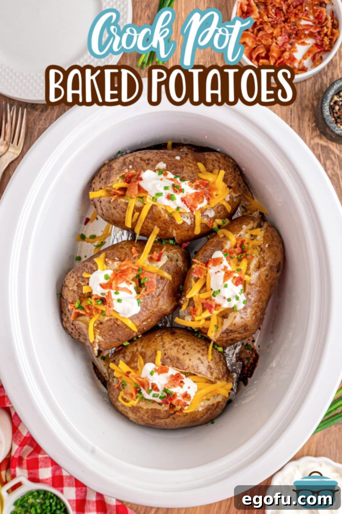 Looking down on a Crockpot full of Baked Potatoes, ready to be served.