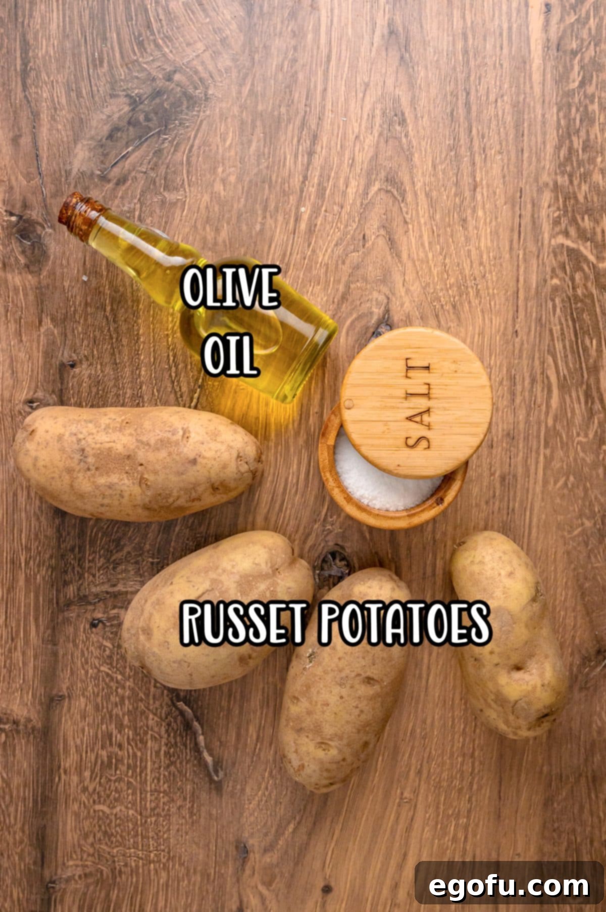 Olive oil, kosher salt, and russet potatoes as ingredients for crock pot baked potatoes.