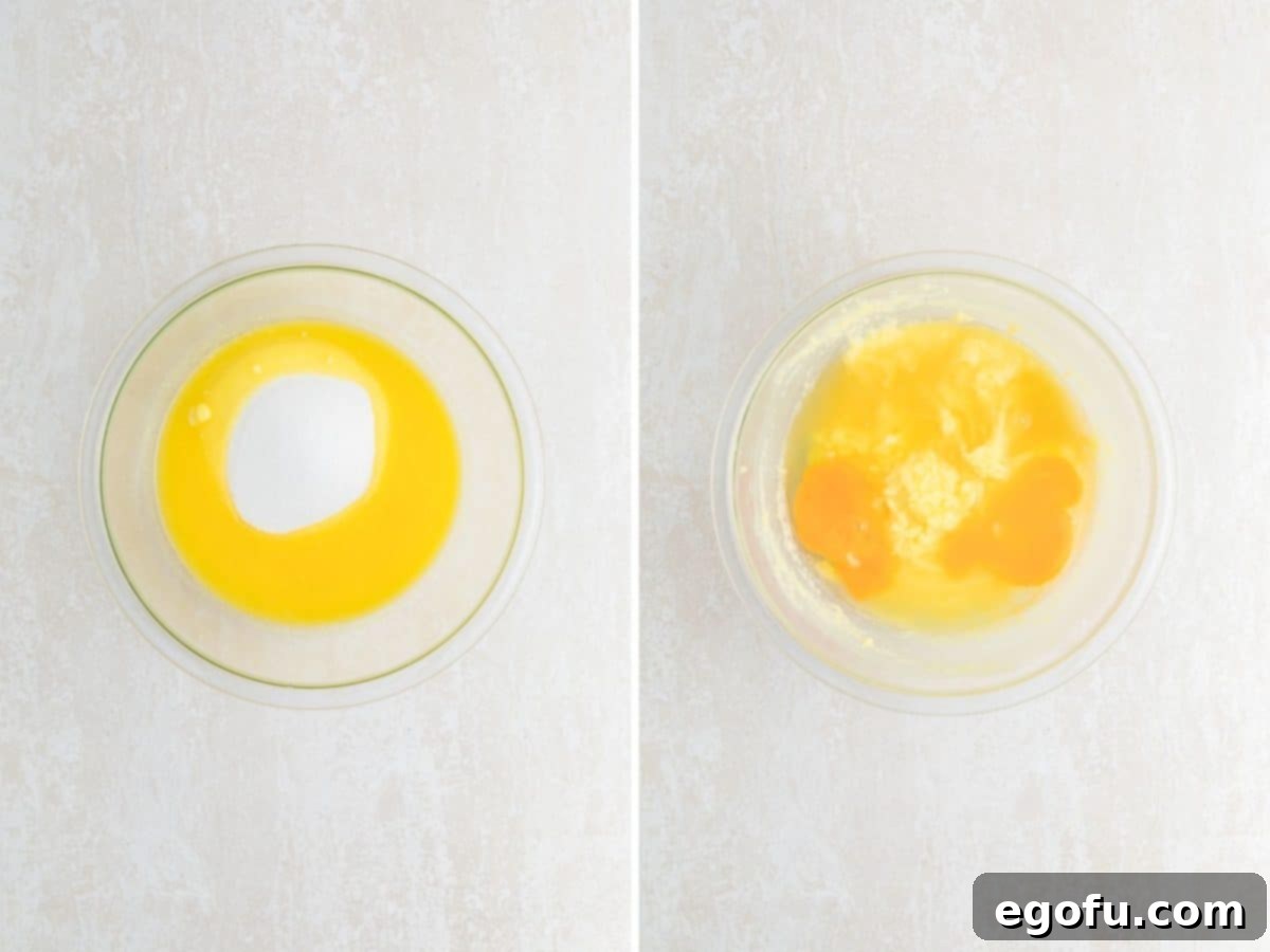 A bowl with melted butter and sugar, with eggs and fresh lemon juice being whisked together to form the wet ingredients for lemon brownies.