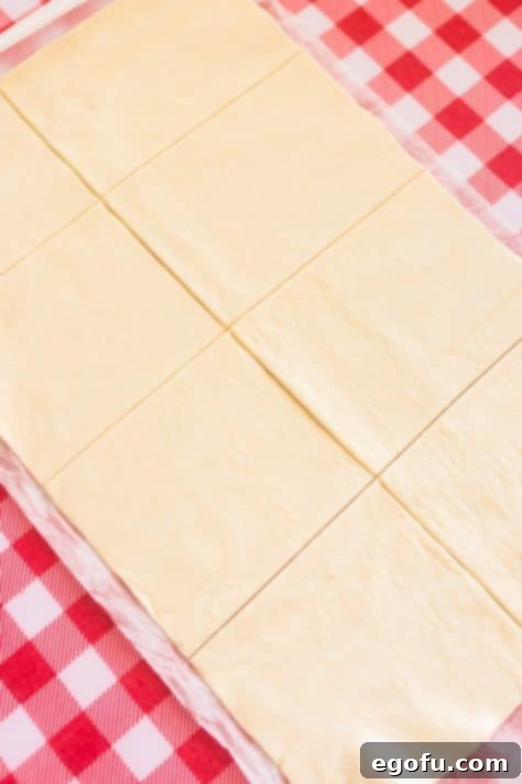 Puff pastry being cut.