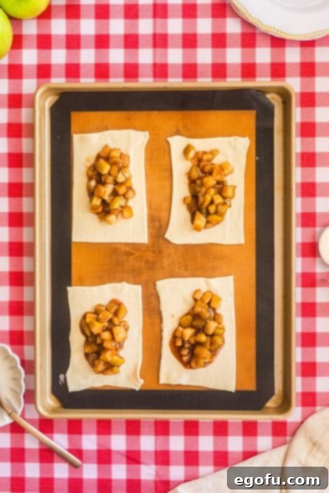 Puff pastry beds with apple pie filling on top.