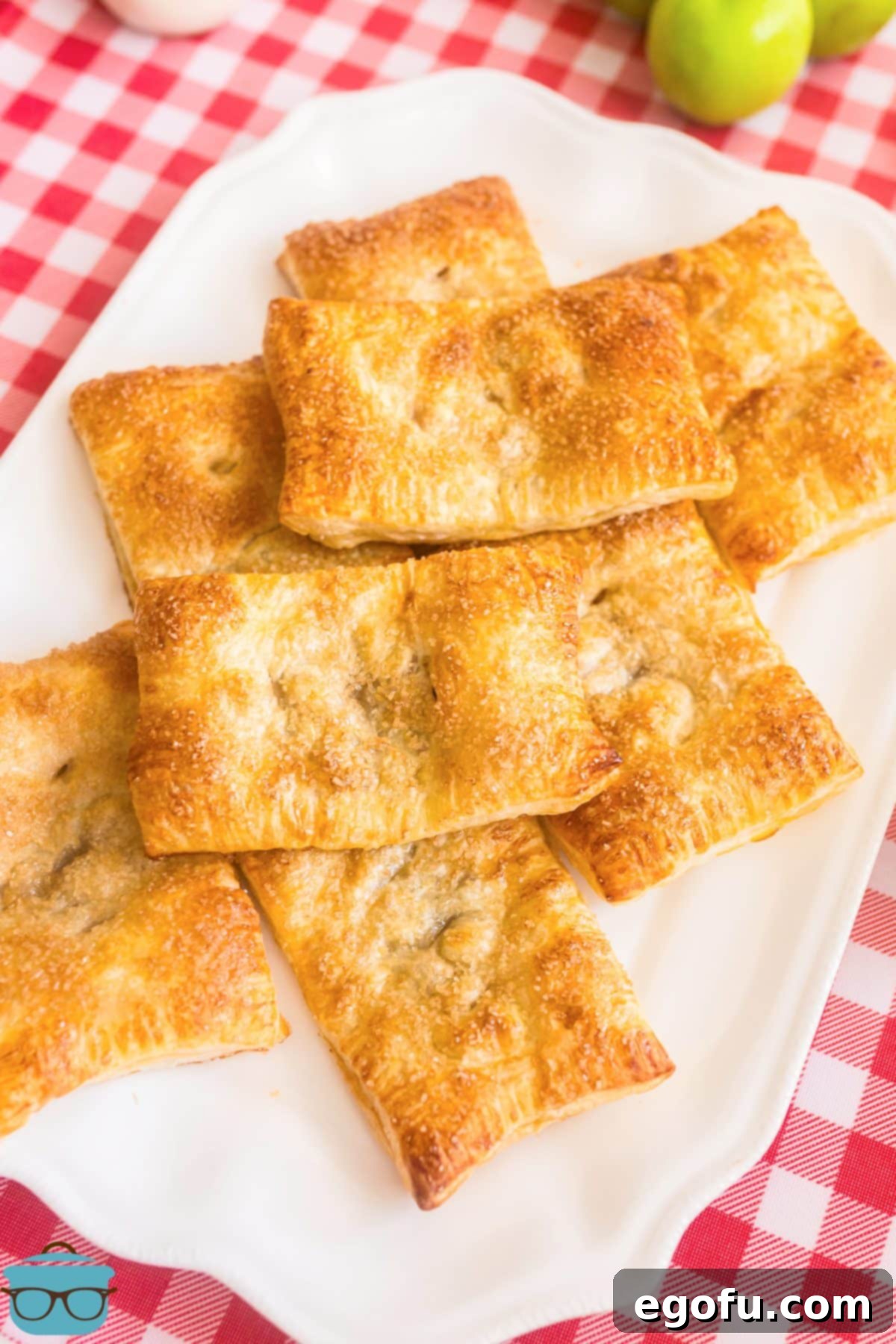 A small pile of fresh made Puff Pastry Apple Pies, ready to be enjoyed.