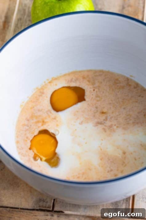 A bowl with eggs, milk, ¼ cup caramel sauce, and vanilla extract.