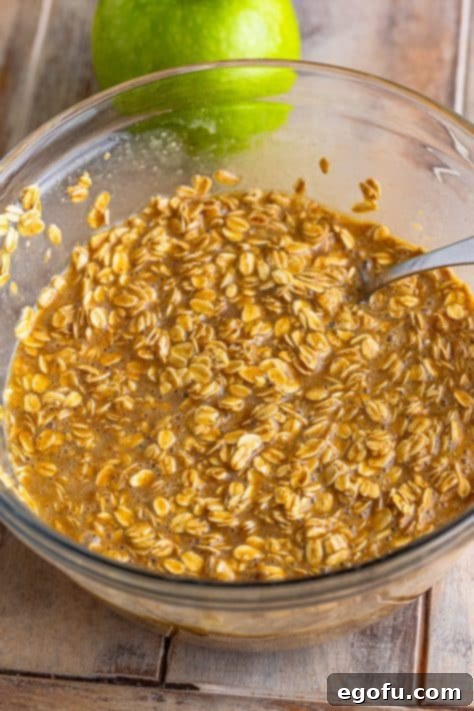 Wet and dry ingredients for baked oatmeal in a bowl.