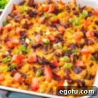 Cheesy Bacon Burger Bake 13 A close-up view of the rich and savory Bacon Cheeseburger Casserole, freshly baked and ready to serve, showing its golden-brown top and bubbling cheese.