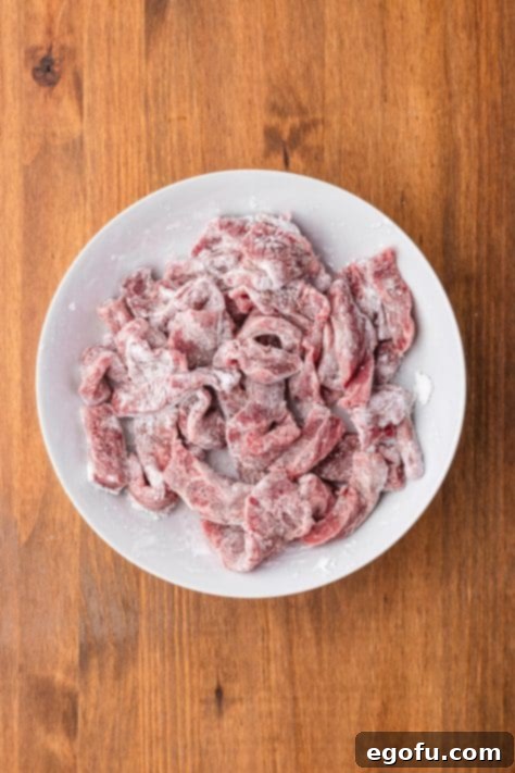 Cornstarch coated flat iron steak on a plate.