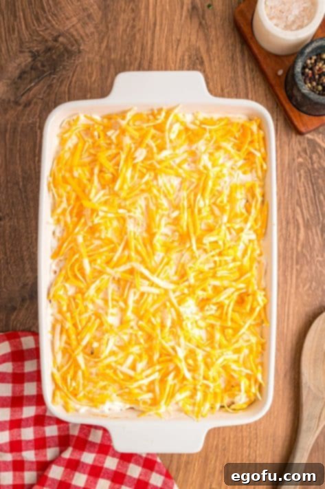 Shredded cheese over a layered casserole.