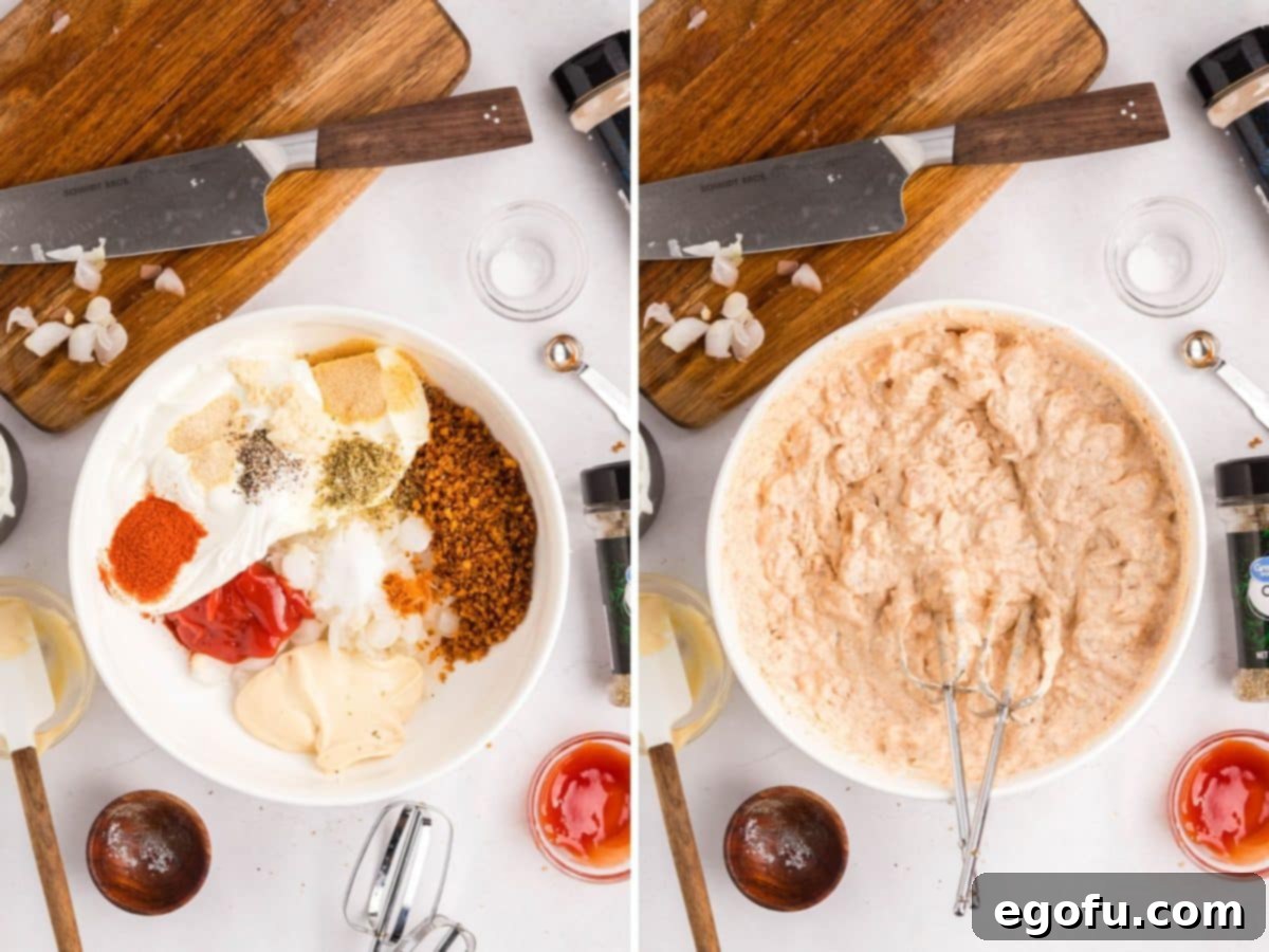 All the creamy dip ingredients being whisked together in a large bowl with a hand mixer.