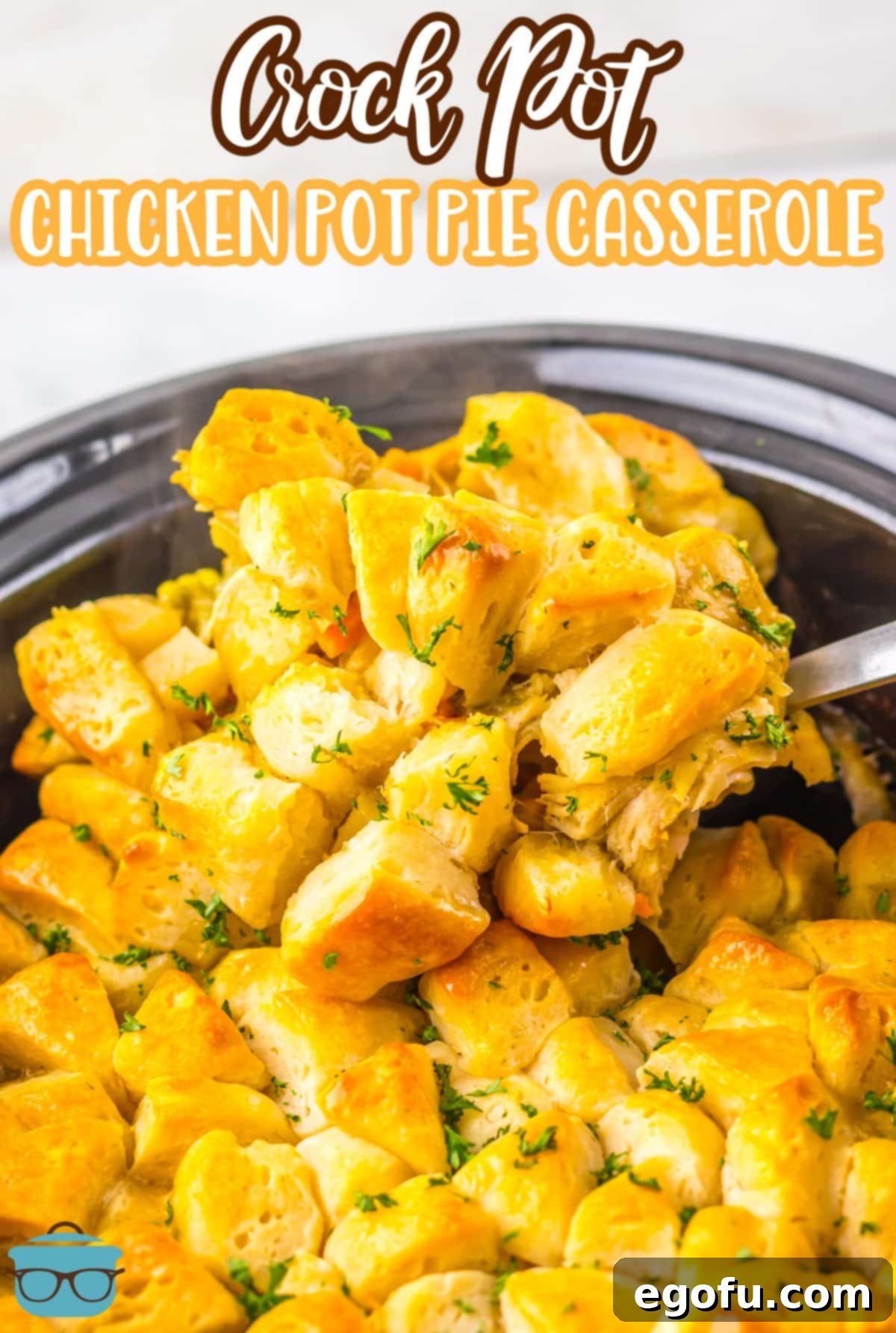 A serving utensil getting a scoop of Crock Pot Chicken Pot Pie Casserole from the Slow Cooker.