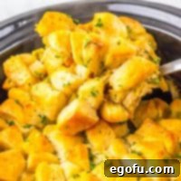 A scoop of Crock Pot Chicken Pot Pie Casserole being removed from the Slow Cooker.