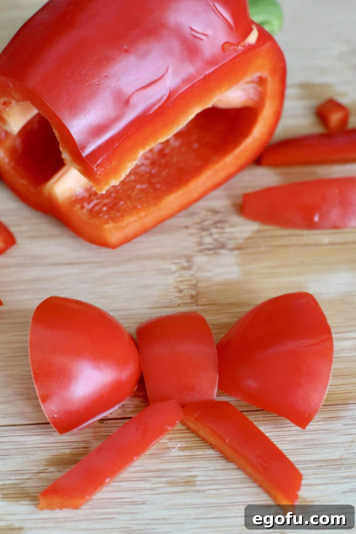 a red bow created from cut pieces of a red pepper.
