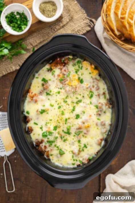 A close-up of the fully baked Crock Pot Ziti, showcasing the perfectly melted and golden-brown cheese topping after slow cooking.