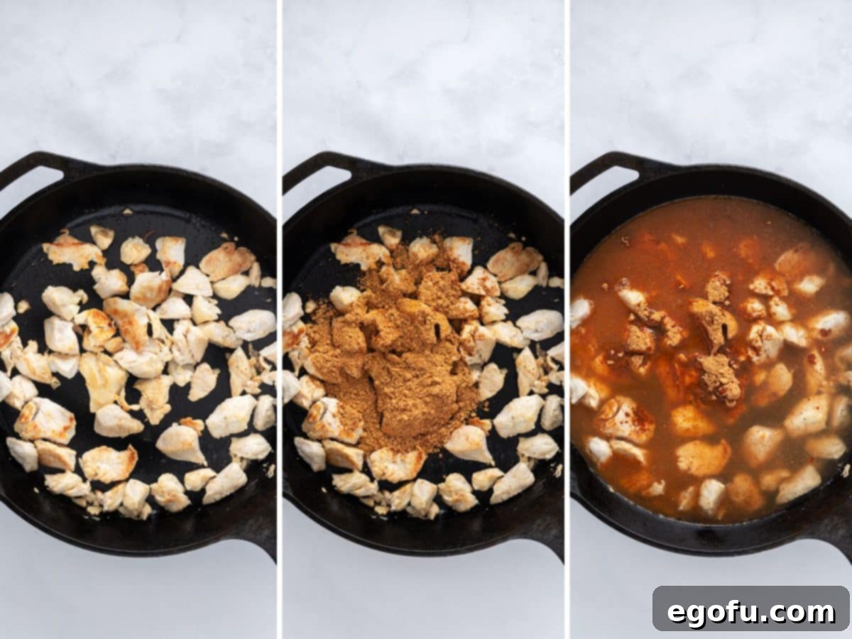 Diced chicken in a skillet with taco seasoning, and broth added.