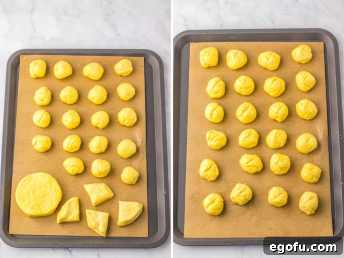 Biscuit dough being cut and rolled into balls.