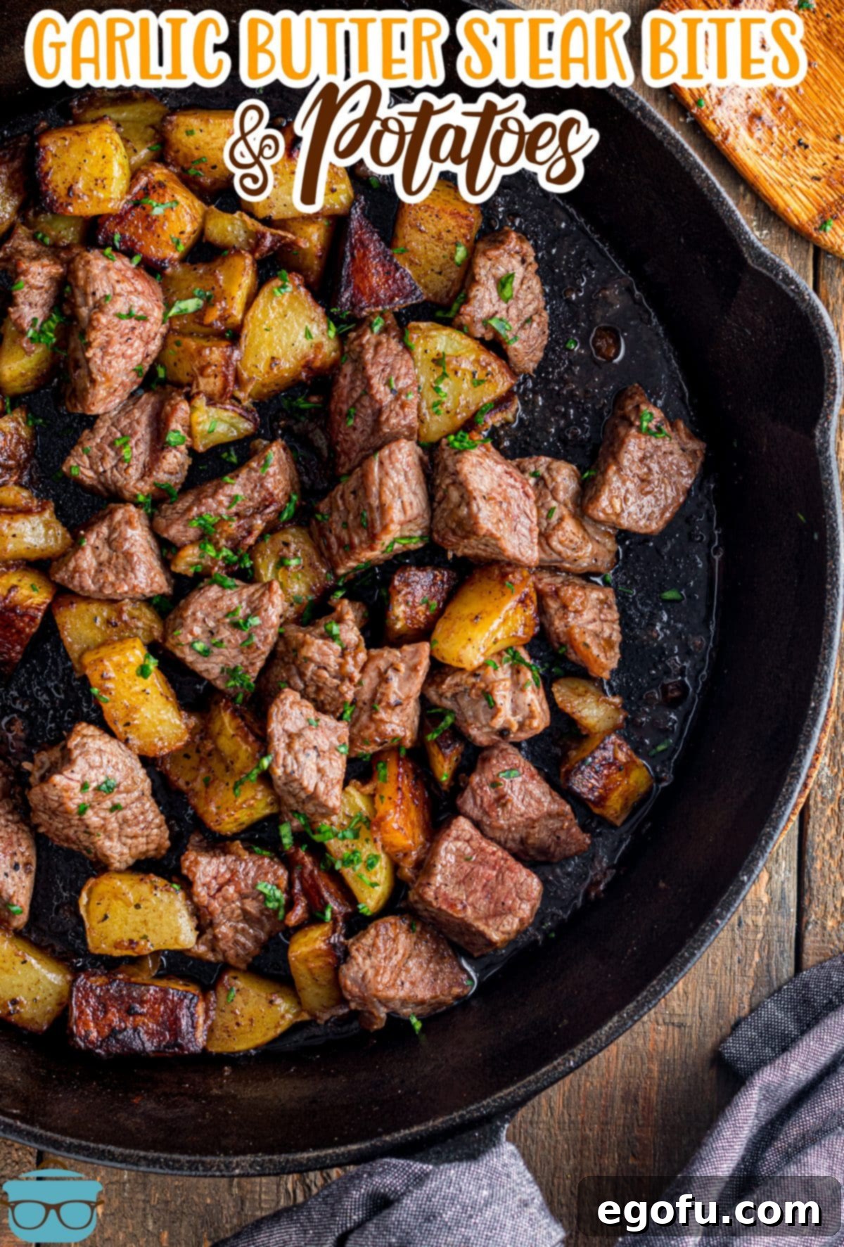 Pan-Seared Garlic Butter Steak Bites with Crispy Potatoes 4 A cast iron skillet filled with perfectly cooked Garlic Butter Steak Bites and Potatoes.