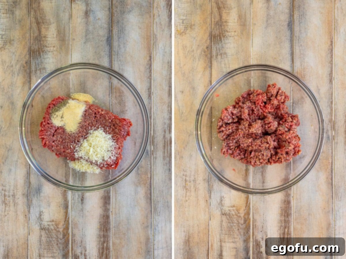 A bowl with ground beef, parmesan, garlic powder, onion powder, salt, and pepper, perfectly mixed for the casserole.