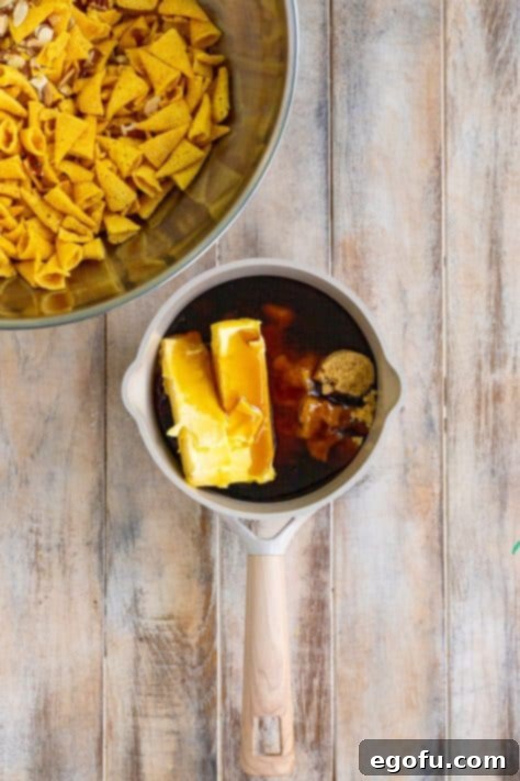 Brown sugar, butter, and corn syrup in a pot, ready to be melted for the caramel sauce.