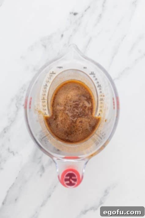 Irresistible King's Hawaiian Cinnamon Buns 11 A butter, cinnamon, and sugar mixture in a bowl.