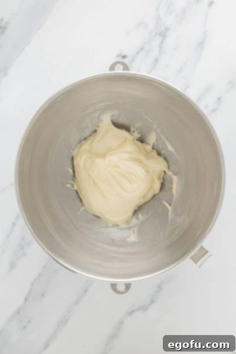 Irresistible King's Hawaiian Cinnamon Buns 14 Homemade icing in a bowl.