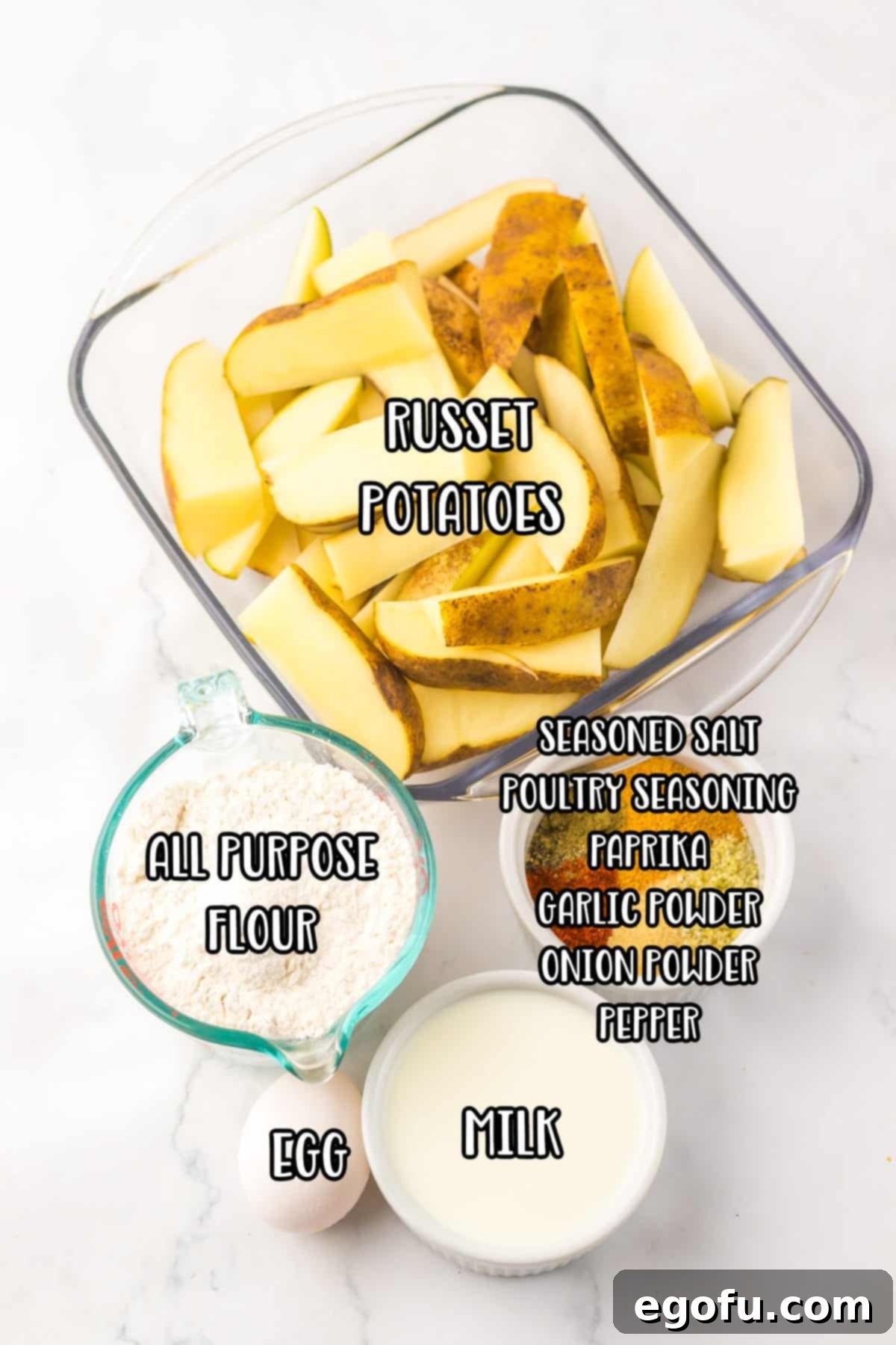 Russet potatoes, all purpose flour, milk, seasoned salt, poultry seasoning, paprika, garlic powder, onion powder, and pepper. 