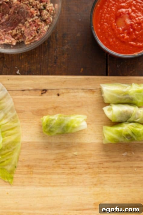 Effortless Crock Pot Cabbage Rolls 14 Cabbage leaves with meat mixture.