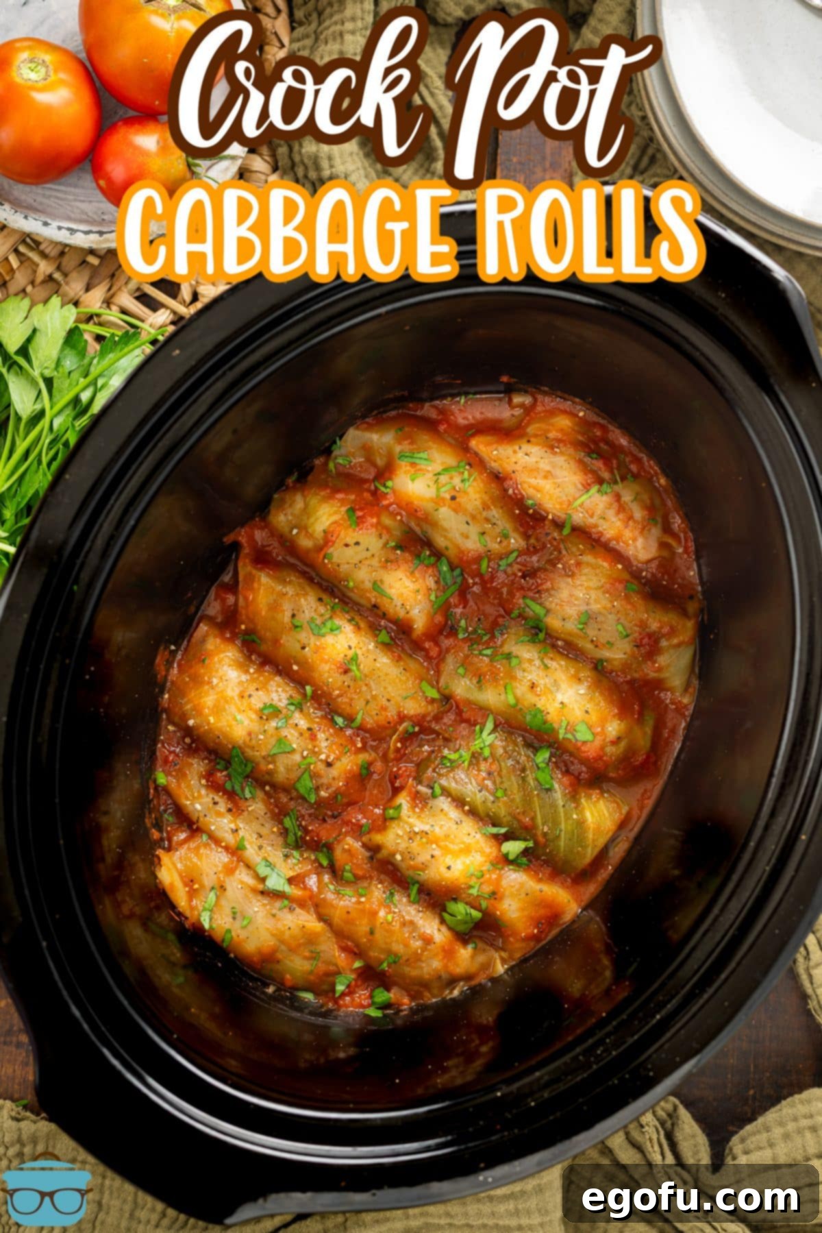 Effortless Crock Pot Cabbage Rolls 3 Looking down on a Crock Pot full of Cabbage Rolls, garnished with fresh herbs, ready to be served.