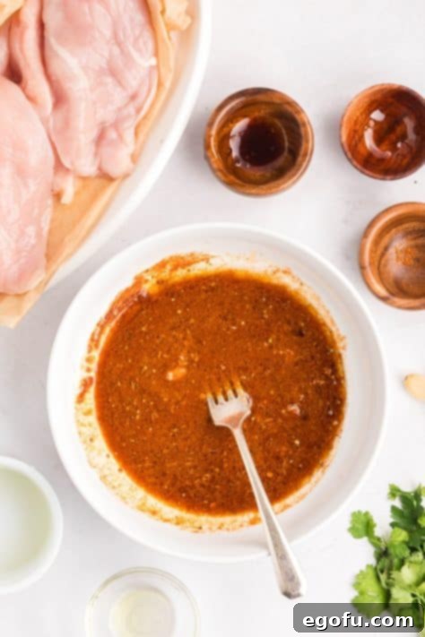 Zesty Fiesta Lime Chicken 6 A bowl with oil, lime juice, minced garlic, teriyaki sauce, honey, and taco seasoning.