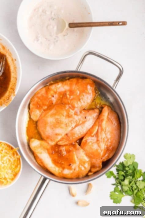 Zesty Fiesta Lime Chicken 8 Chicken cooking in a skillet.