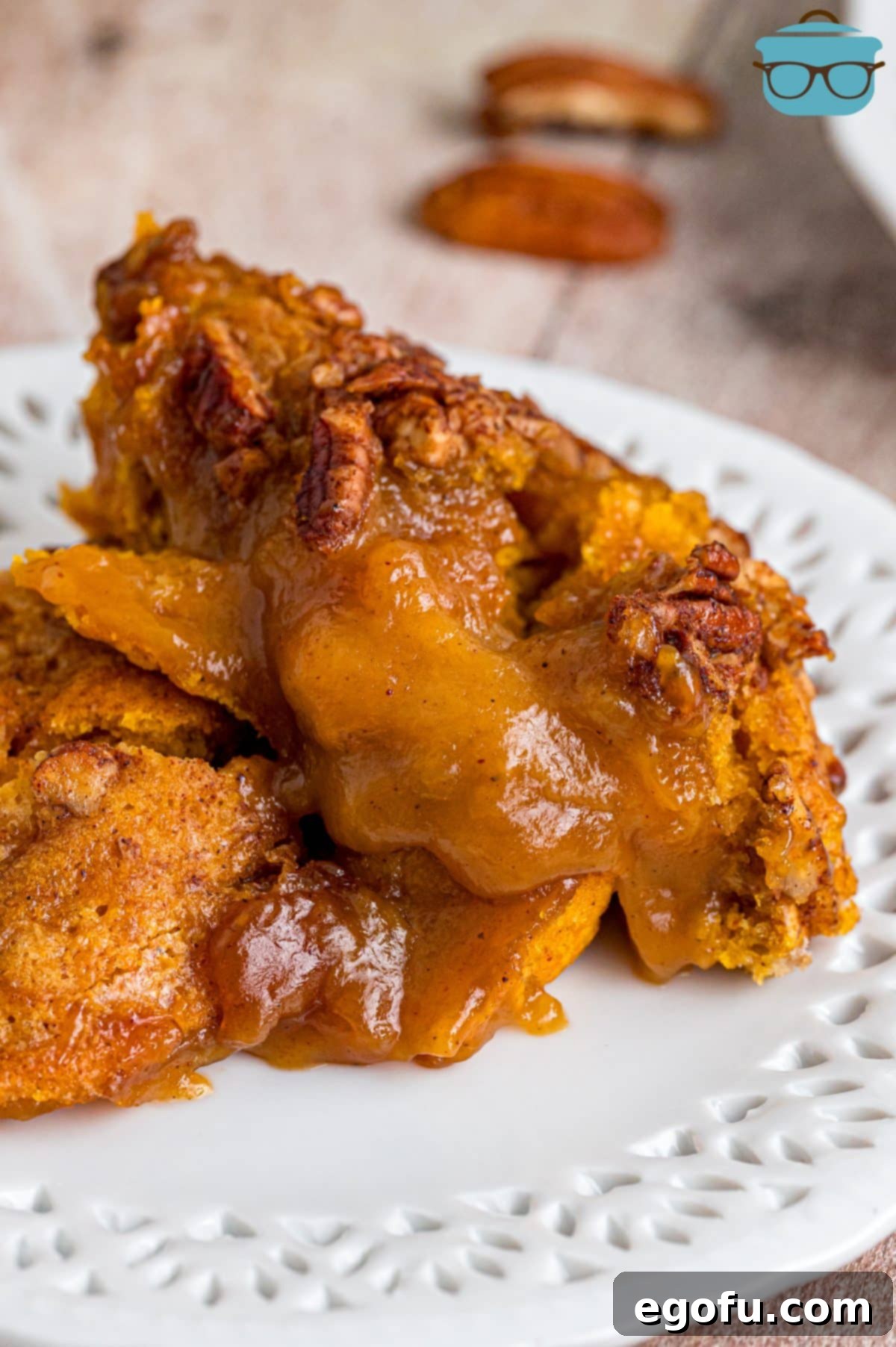 Spiced Autumn Pumpkin Bake 2 Close up looking at a plate of Pumpkin Cobbler, served warm with a scoop of melting vanilla ice cream.