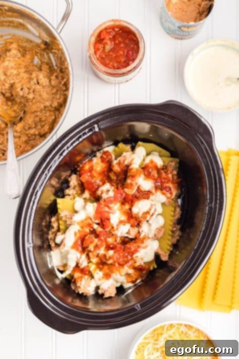 Slow Cooker Fiesta Lasagna 13 Layers of Mexican Lasagna in a Crockpot.