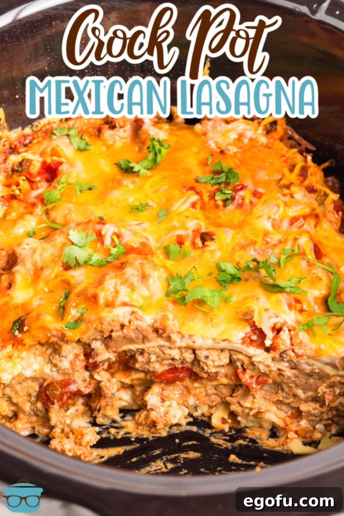 Slow Cooker Fiesta Lasagna 3 A Slow Cooker with a scoop of Mexican Lasagna missing.