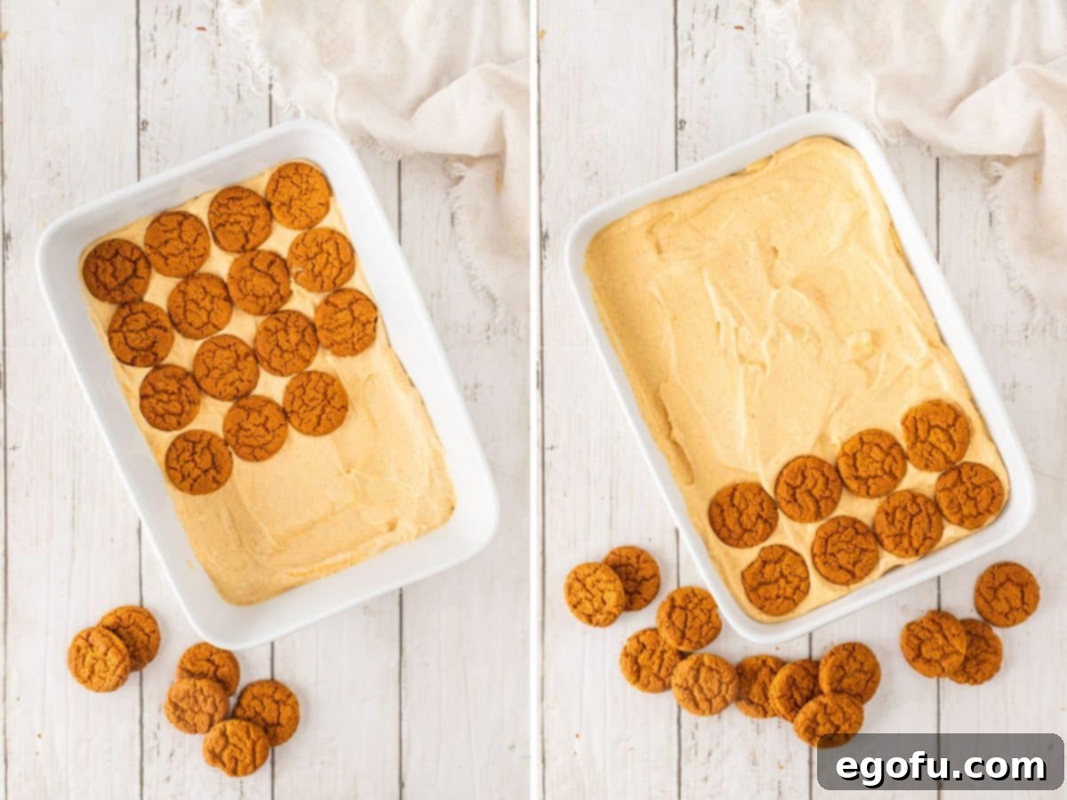 Layers of creamy pumpkin filling and gingersnap cookies being meticulously arranged in a 9x13-inch baking dish.