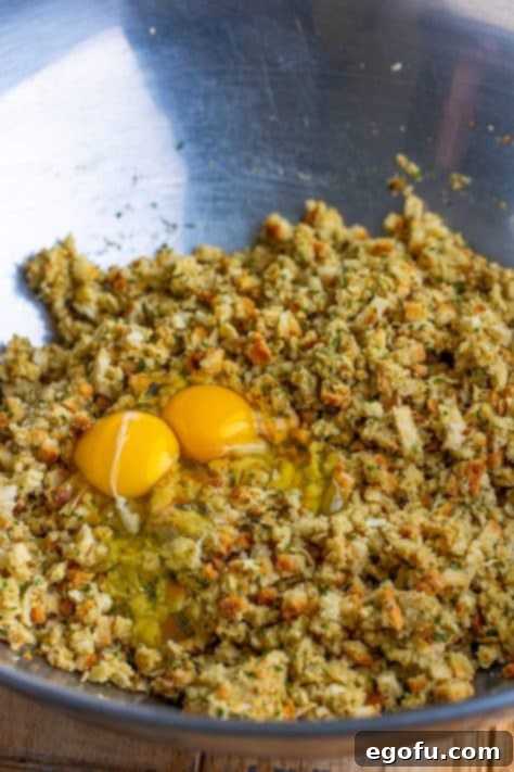 Eggs being added to a stuffing mixture.