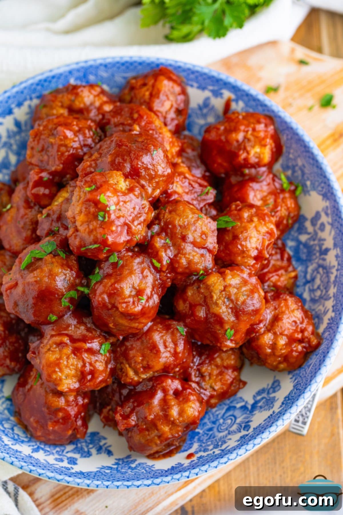 Looking down on a serving bowl of Crock Pot Gobbler Meatballs.