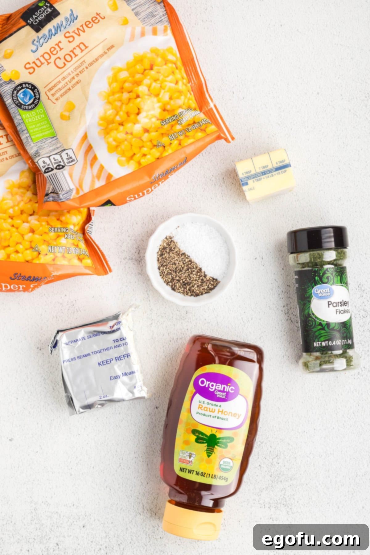 Frozen corn, honey, salt, pepper, cream cheese, butter, and dried parsley.