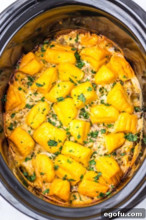 Sausage Gravy with biscuits cooking in a Slow Cooker.