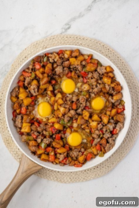 eggs added to breakfast hash skillet.